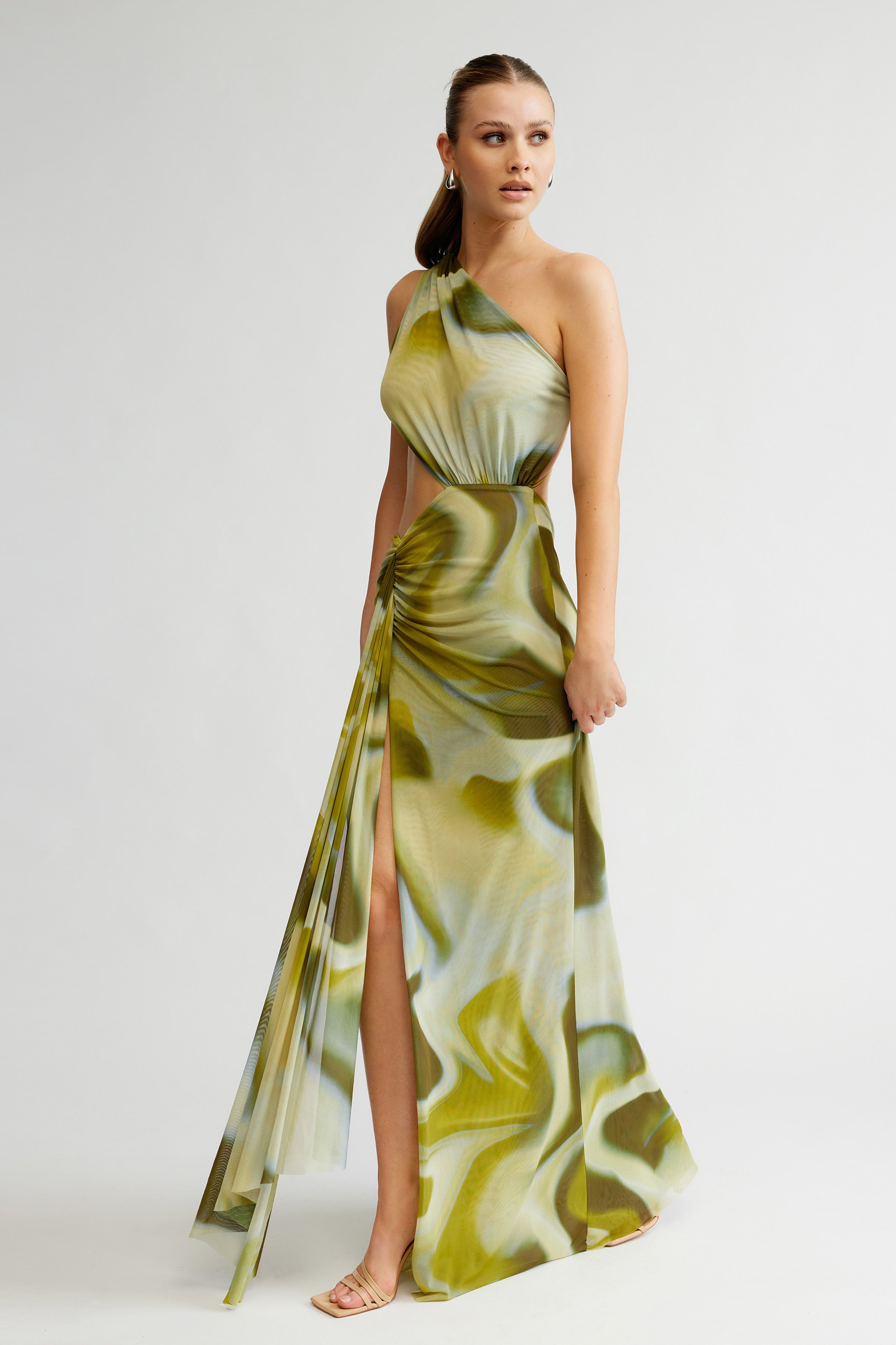 Zaniah Dress featuring a one-shoulder backless design with side cutout and high slit in sage liquify print for formal occasions