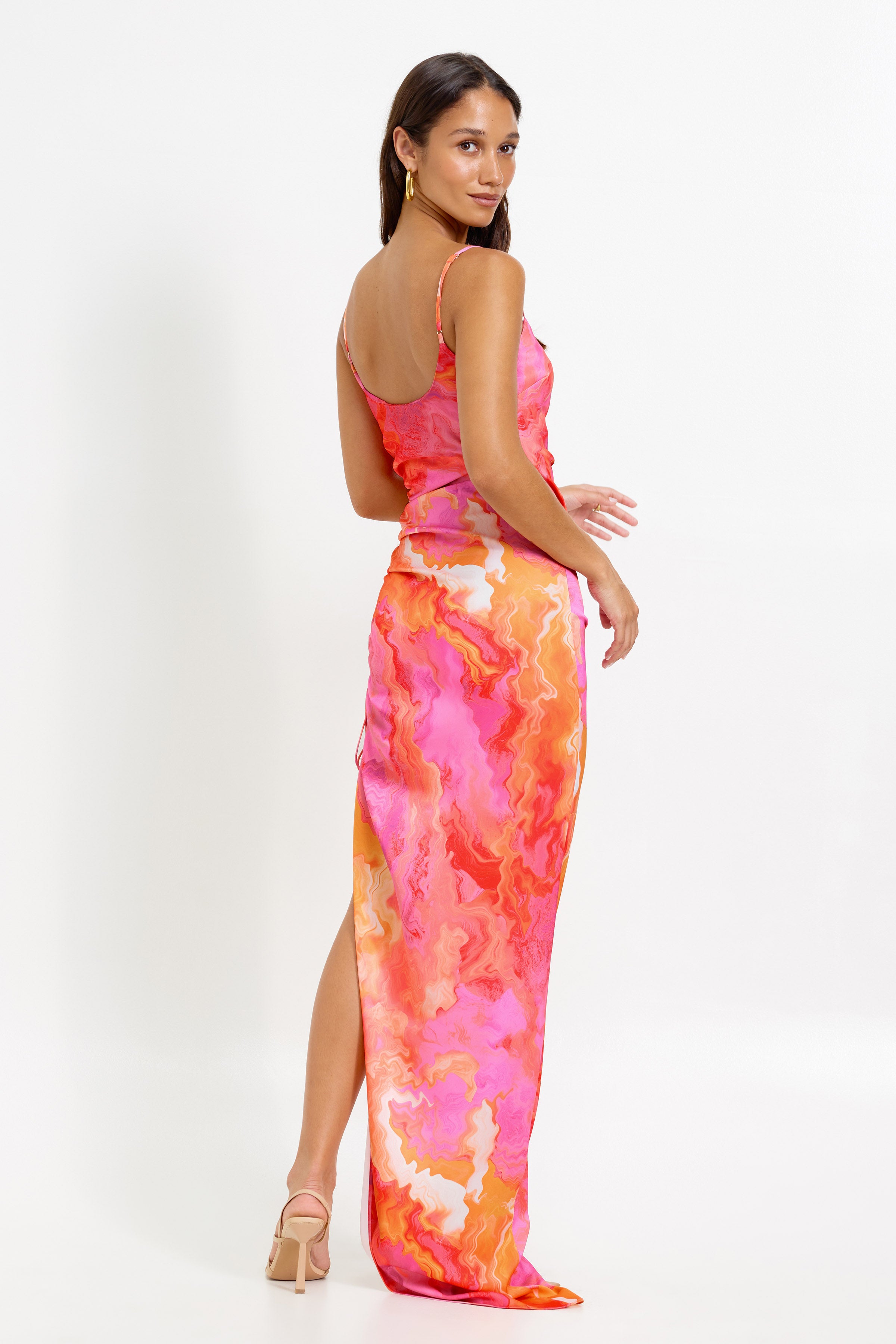 Zanna Dress featuring a bra-friendly silhouette with a small train and split in vibrant pink and orange print for cocktail occasions