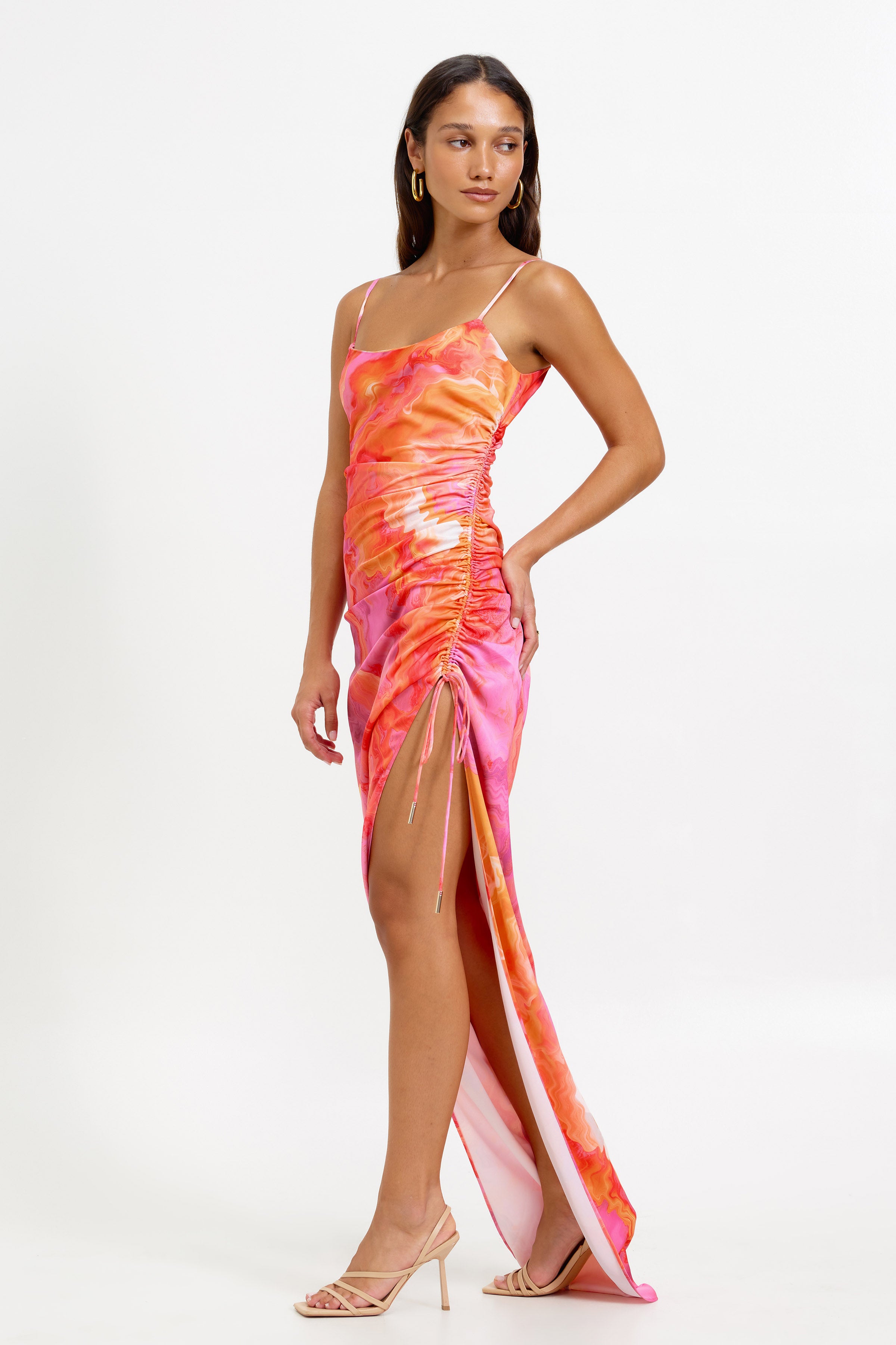 Zanna Dress featuring a bra-friendly silhouette with ruched side and high split in vibrant orange and pink print for cocktail occasions