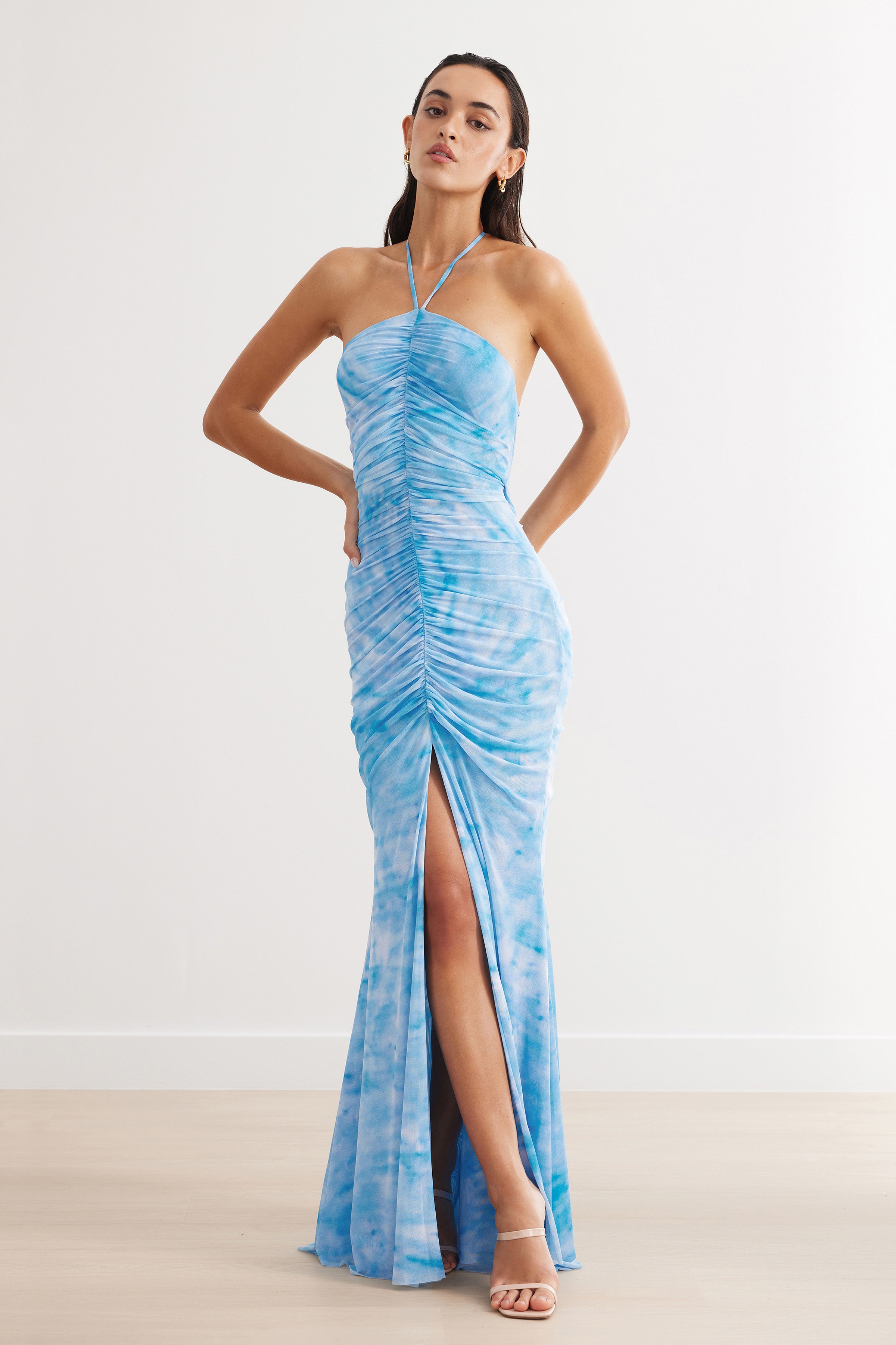 Amber Dress featuring a ruched silhouette with halter neck and split hem in blue print for formal and wedding guest occasions