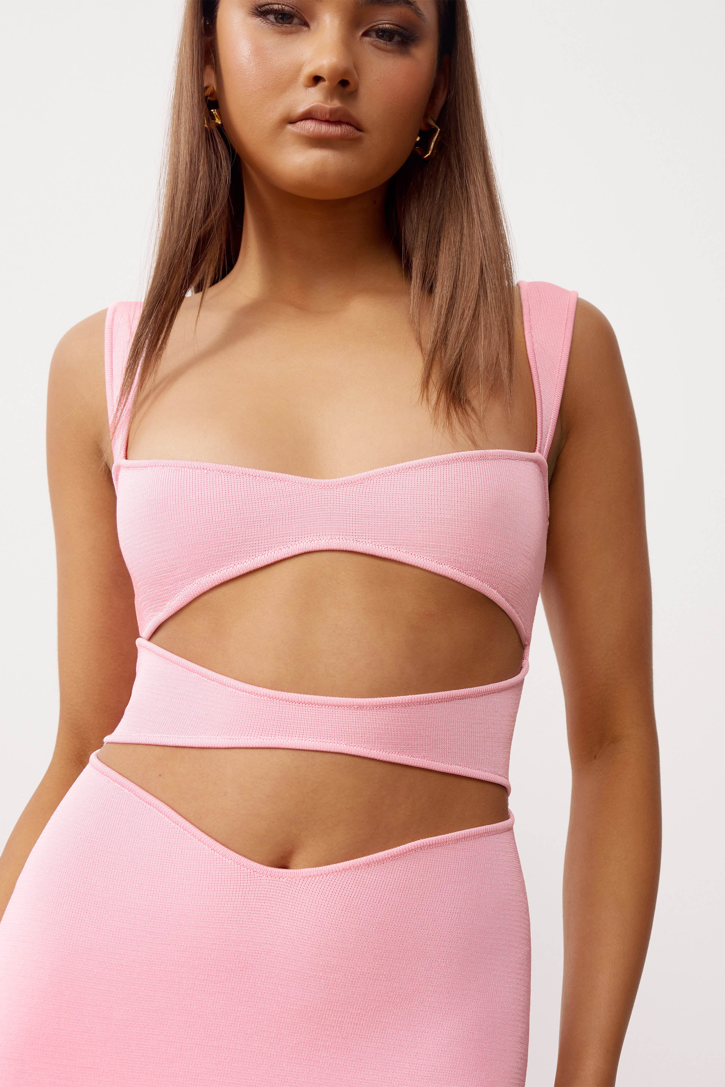 Haru Dress featuring a cut-out design in powder pink knit fabric for cocktail and party occasions