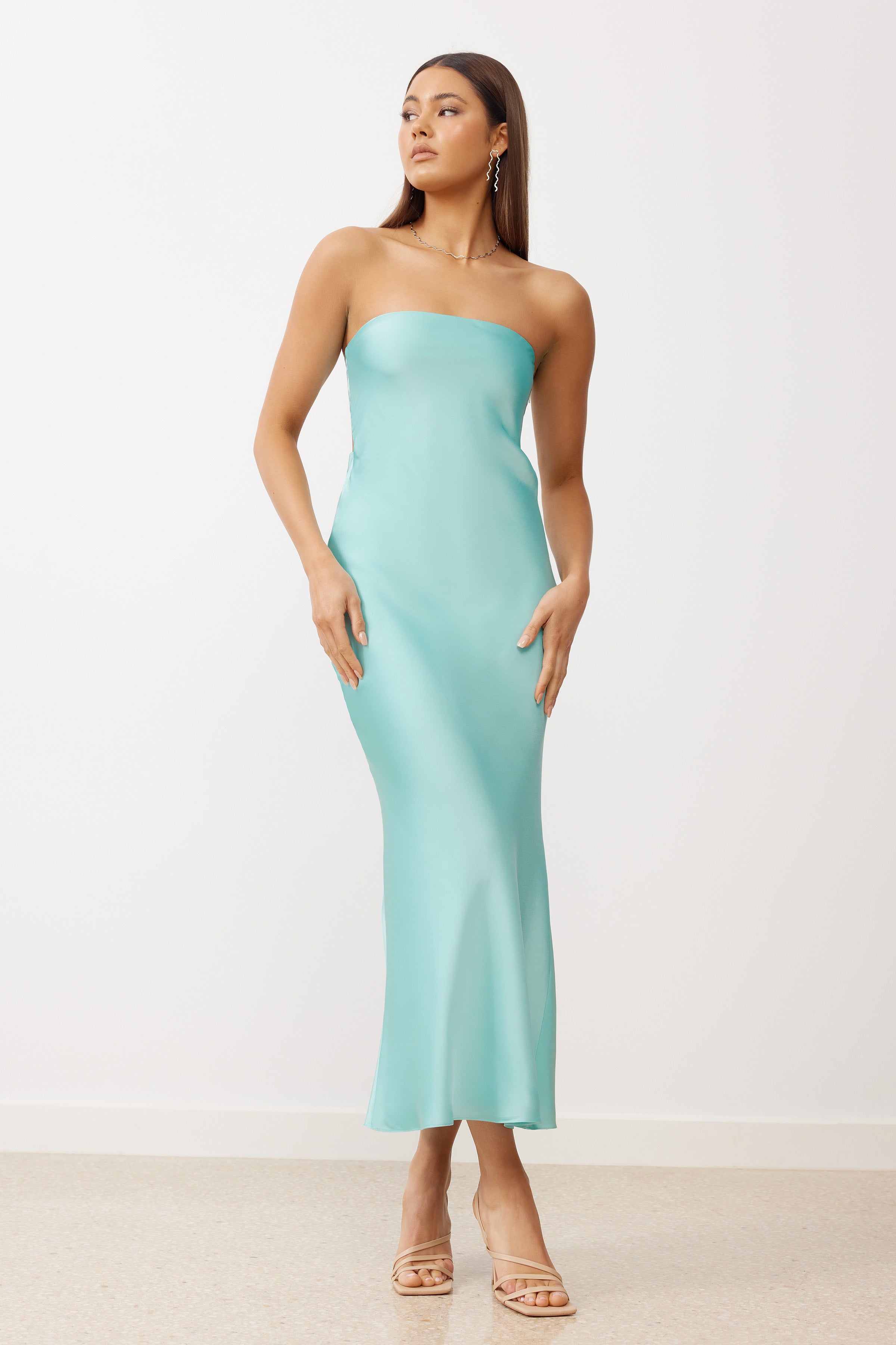 Indra Dress featuring a strapless silhouette and sleek fit in aquamarine satin for formal and wedding guest occasions