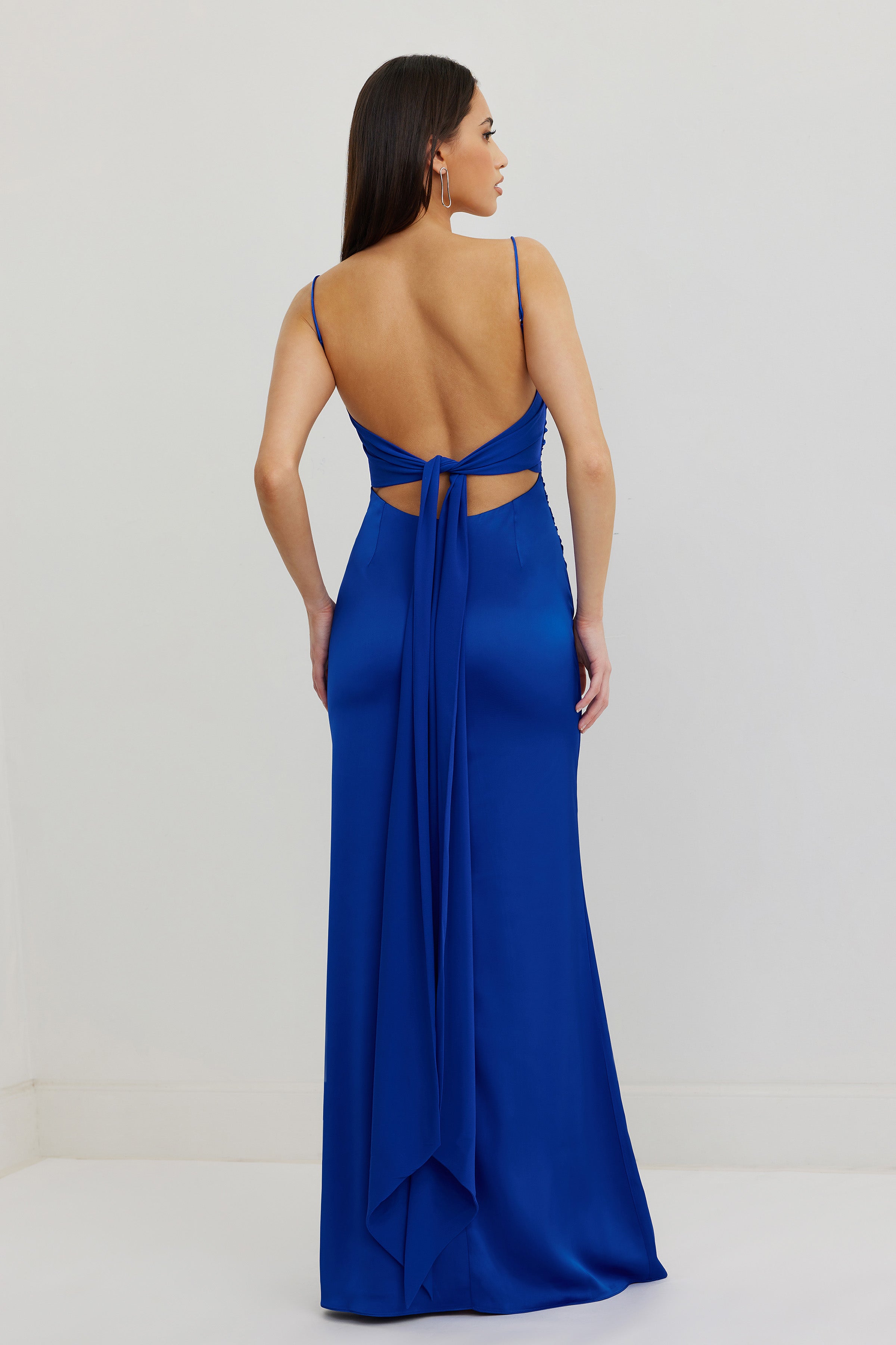 Ivy Dress featuring a backless design with tie detail in vibrant cobalt satin for formal and black tie occasions