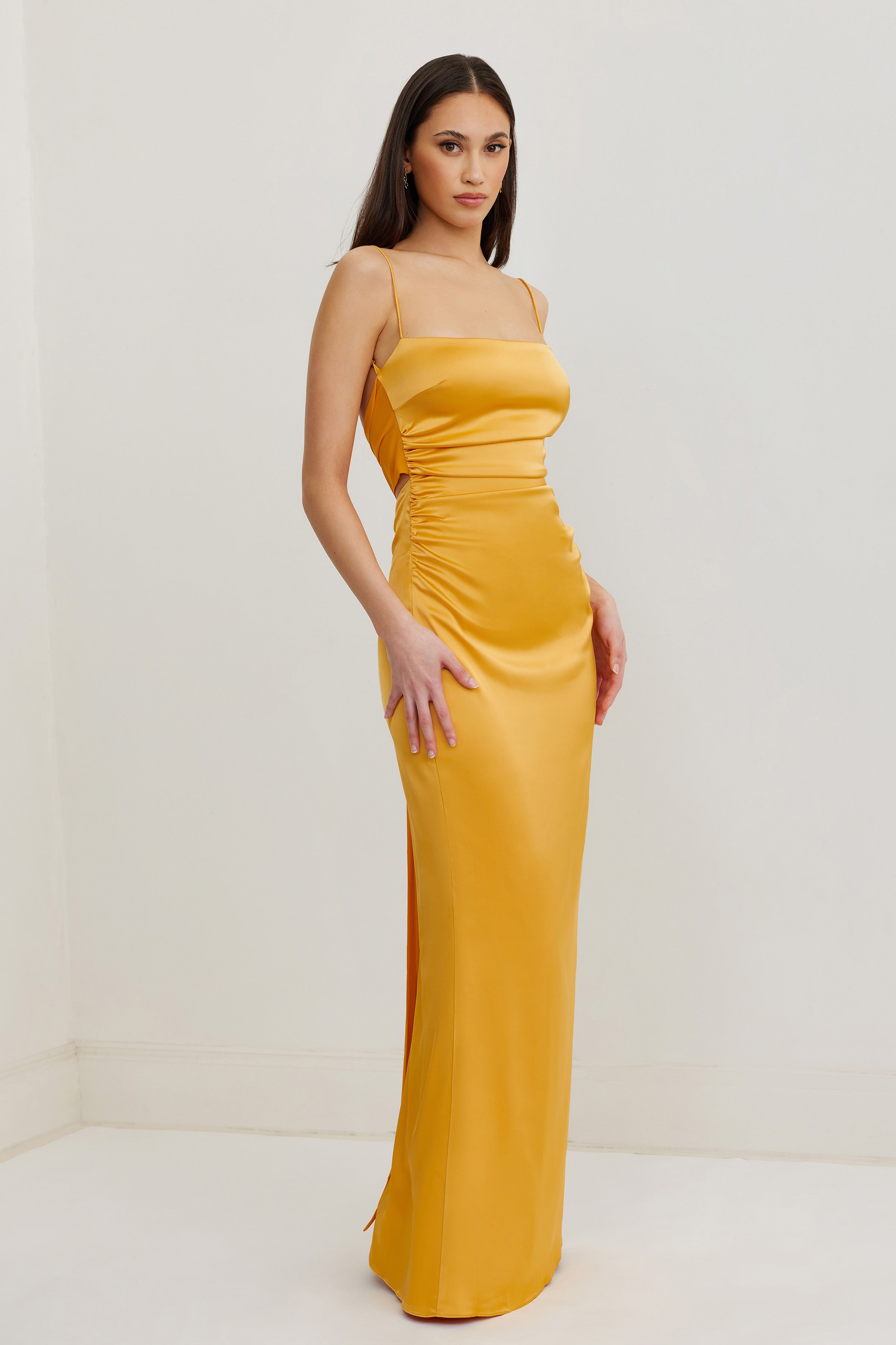 Ivy Dress featuring a sleek ruched silhouette with slim straps in honey for elegant formal and wedding guest wear