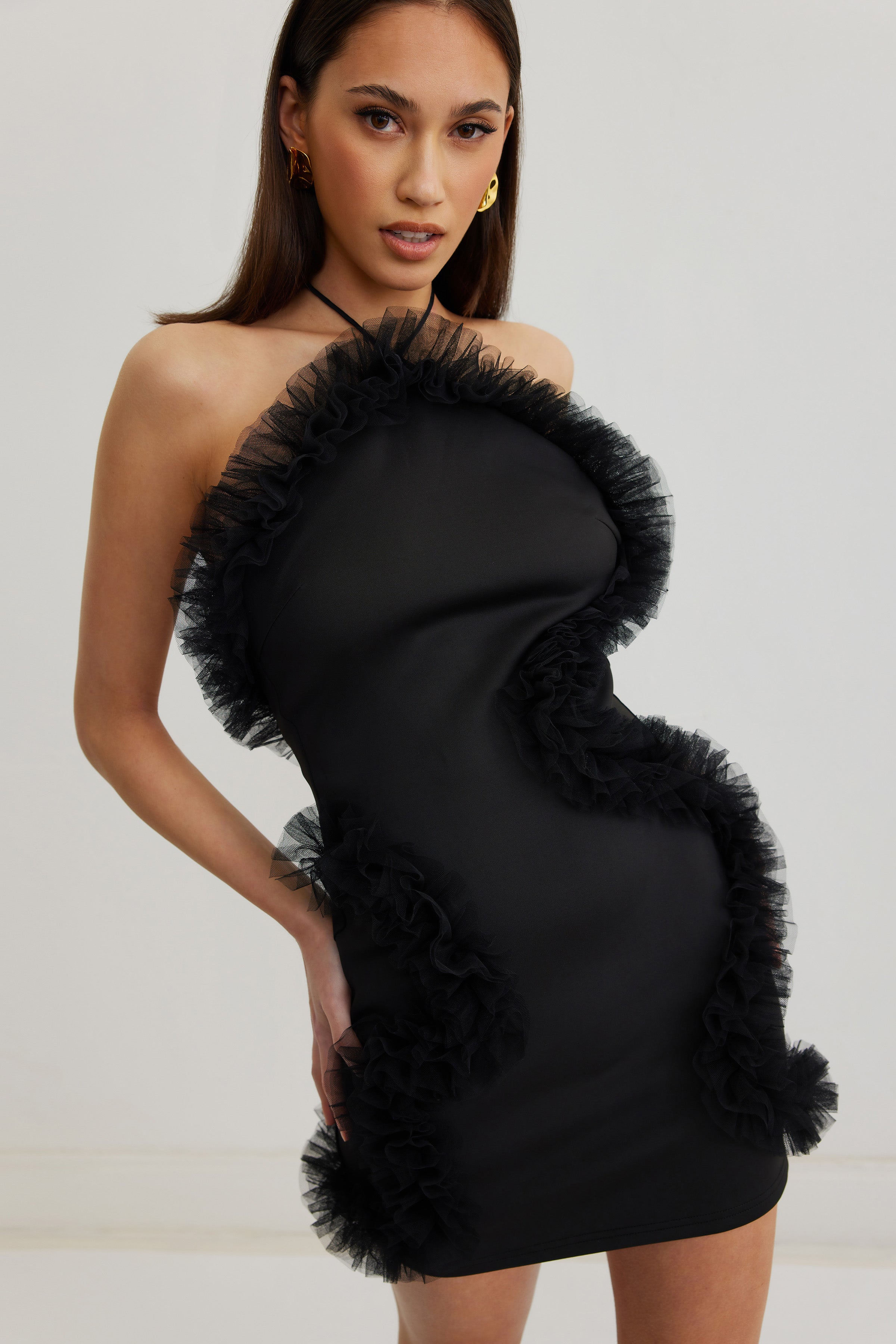 Jewel Dress featuring a black backless halter neck and ruffled trim for elegant cocktail and party occasions