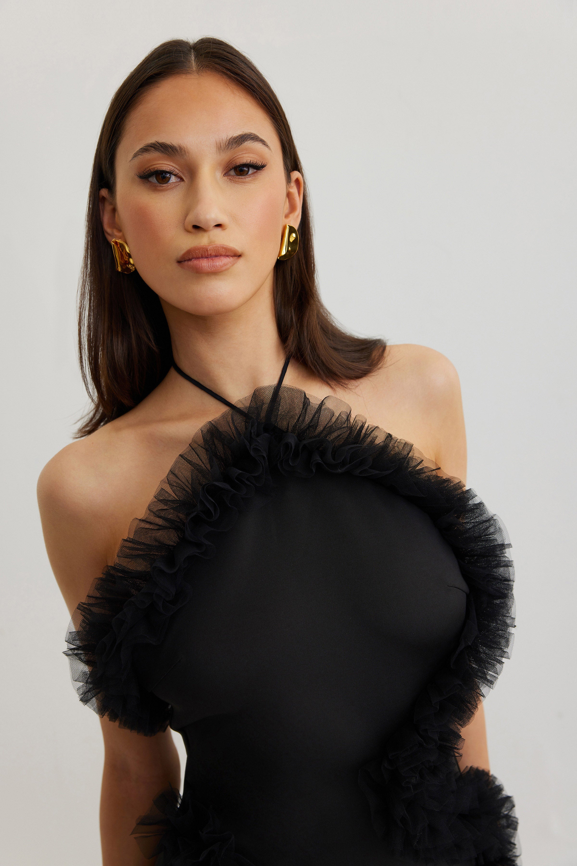 Jewel Dress black with ruffled trim and halter neck in backless design for sophisticated party and cocktail looks