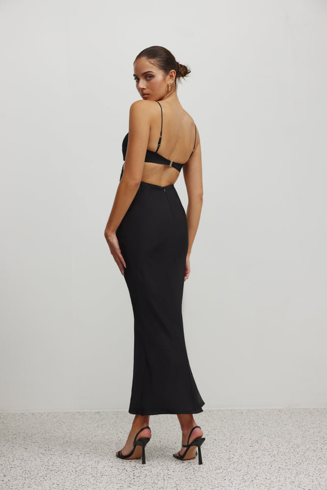 Karma Dress featuring a sleek backless design with thin straps and fitted silhouette in black satin for formal occasions
