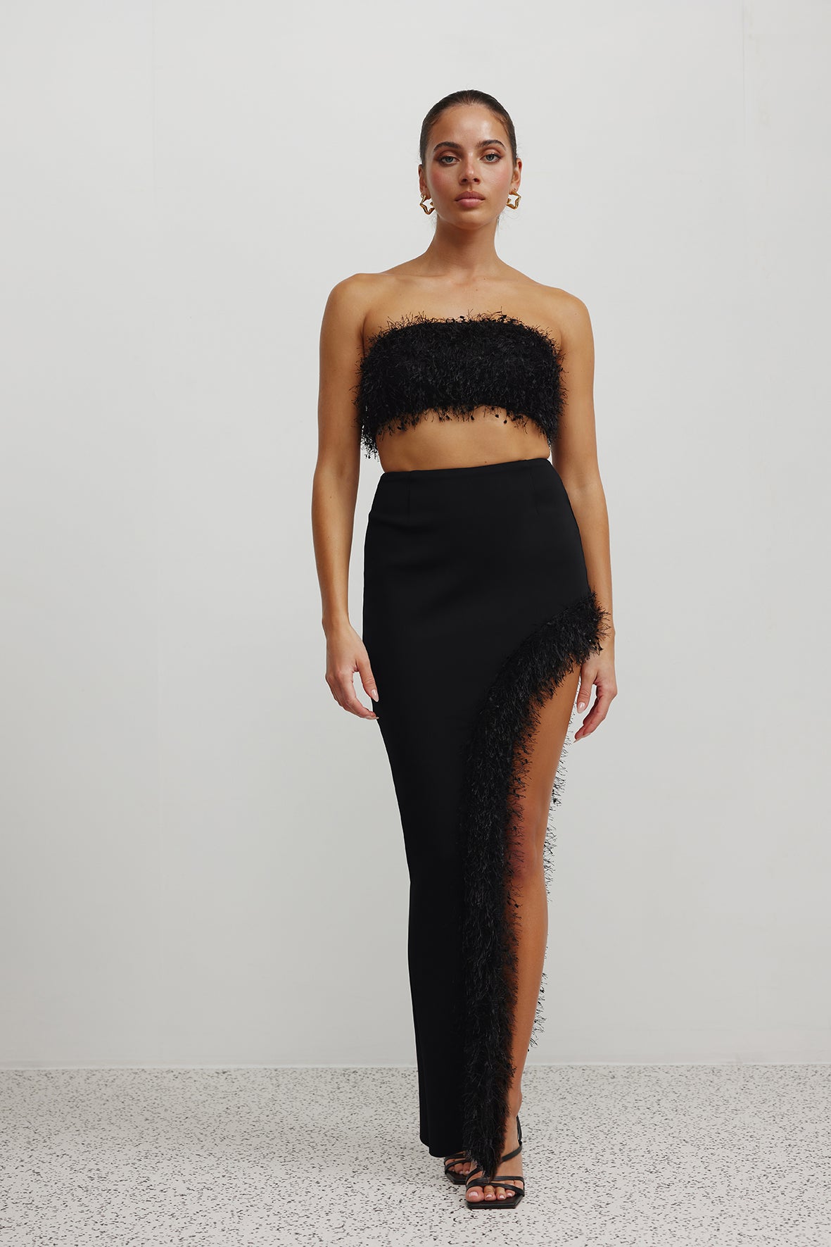 Margarita Set featuring a feather-trimmed bandeau and high side split skirt in black for formal occasions