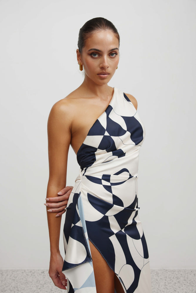 Samira Dress featuring a one-shoulder design, abstract navy and white print, and high side split for formal occasions
