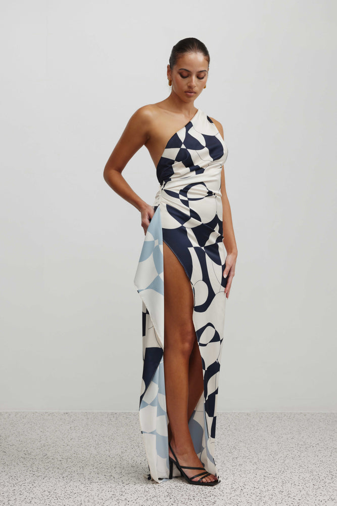 Samira Dress featuring a one-shoulder design, high side split, and abstract navy print for formal and black tie occasions