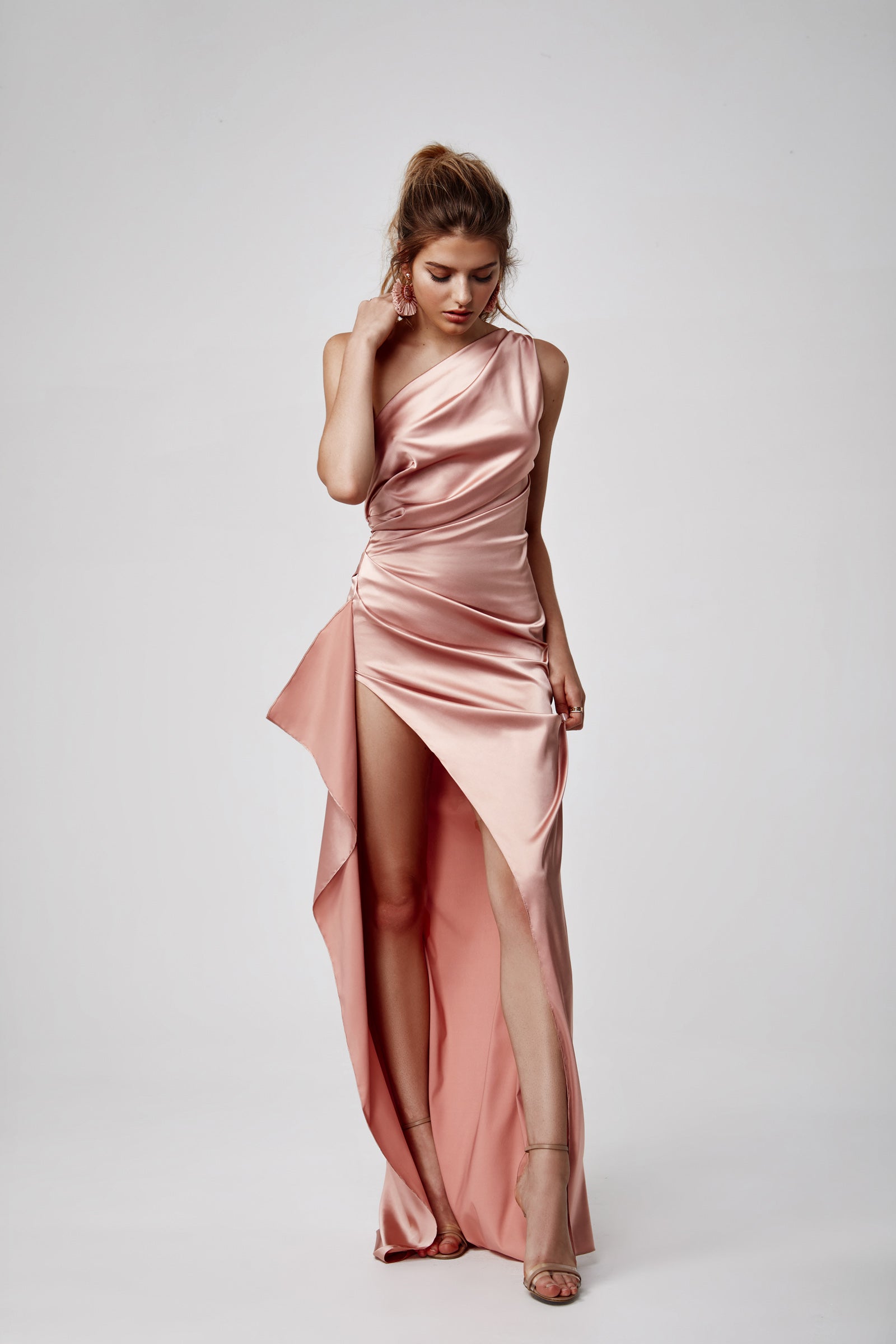 Samira Dress in elegant pink satin with ruched one-shoulder design and dramatic high thigh split for formal occasions