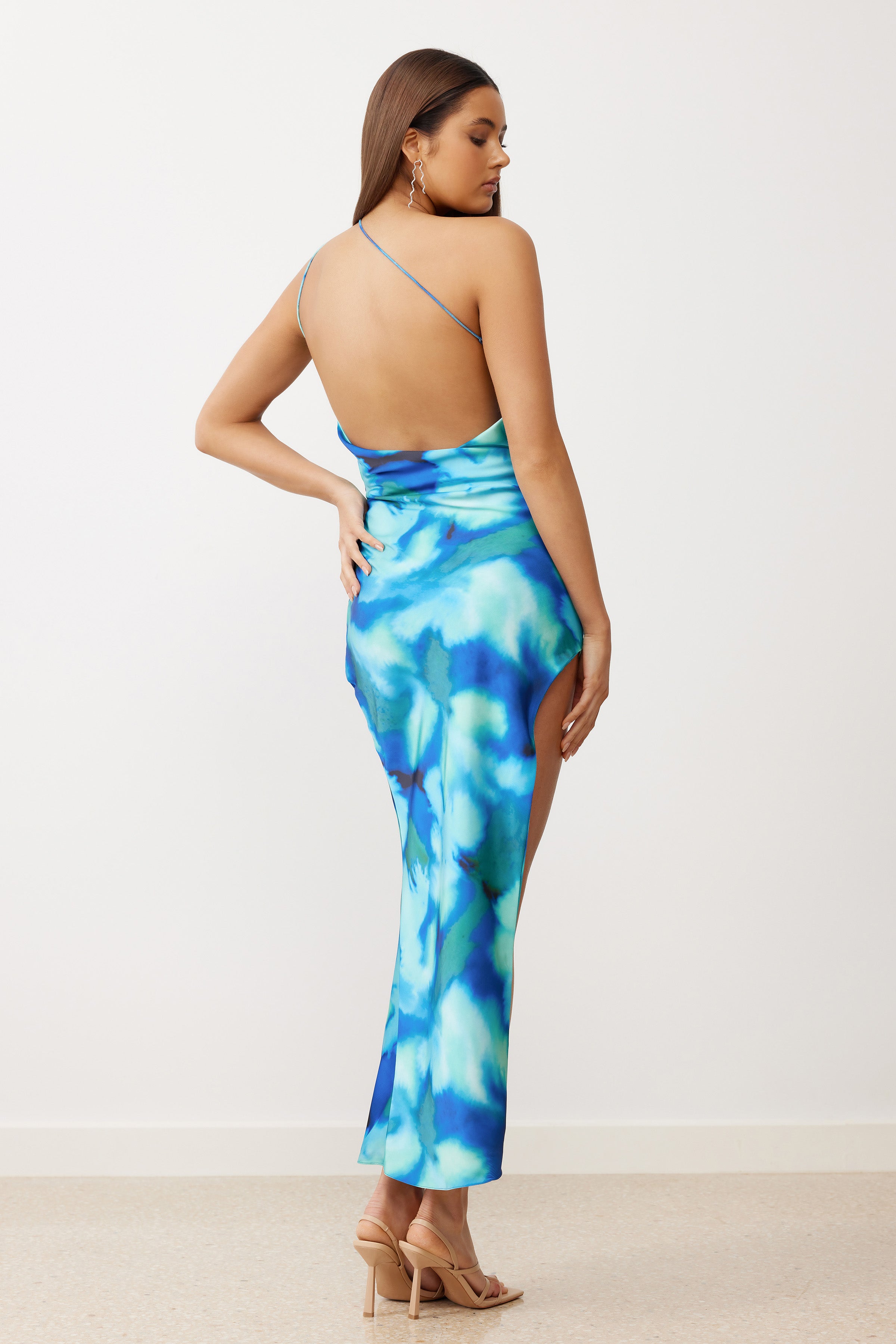 Tide Dress featuring a backless silhouette and high side split in vibrant blue print for cocktail and formal events